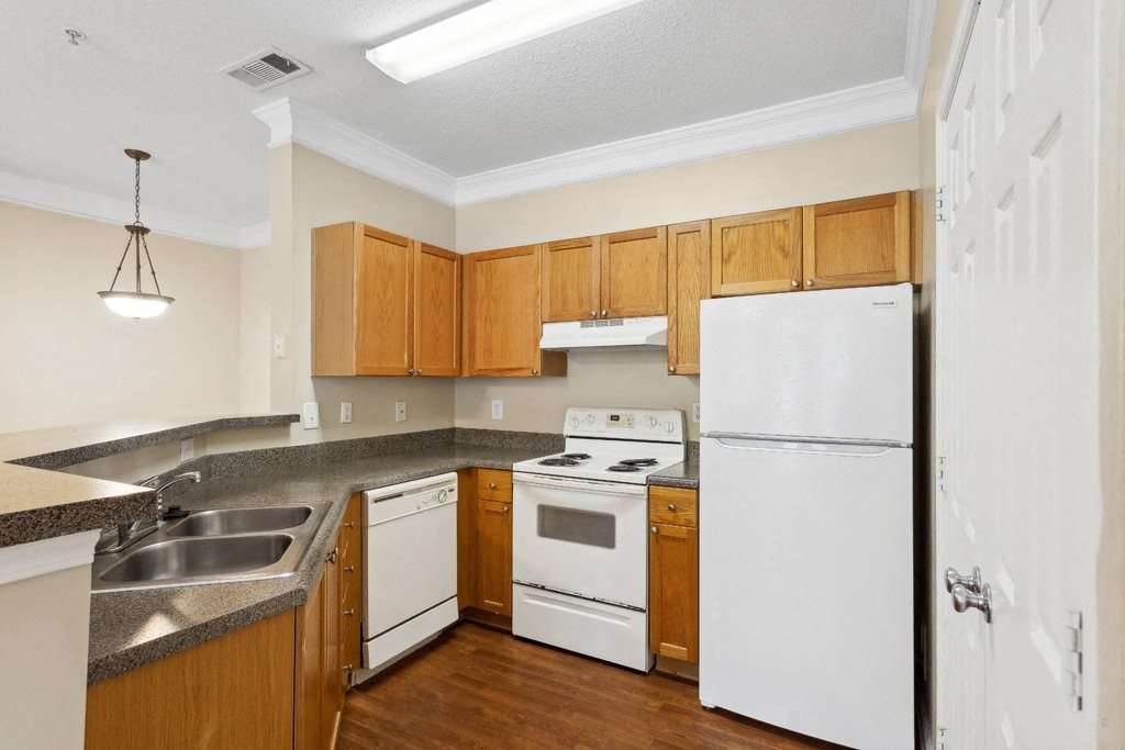 Kitchen with wood cabinets at Longwood Vista Apartment Homes in Atlanta GA